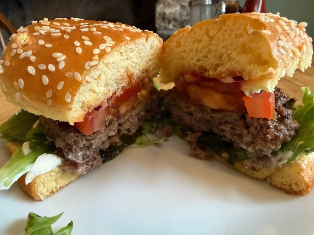 a tasty burger cut in two halves